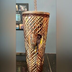 Gold Christmas edition Starbucks cup